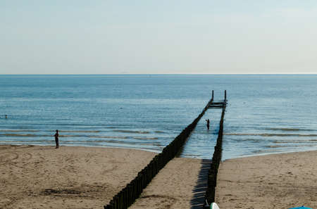 Westkapelle, The Netherlands, August 2019. The beaches of this town are wide and clean, the long rows of poles that stretch towards the sea characterize the landscape. Beautiful sunny summer dayのeditorial素材