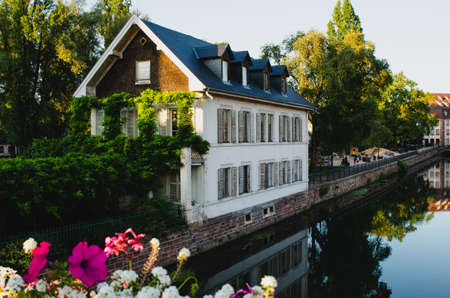 Strasbourg, France, August 2019. The historic center offers the view of pleasant and relaxing glimpse: the characteristic period houses are reflected on the water mirror of the canals.のeditorial素材