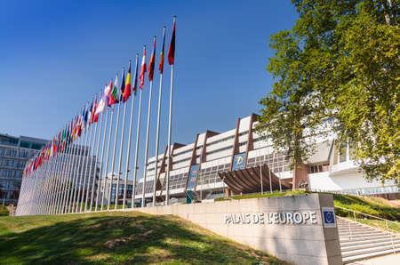 Strasbourg, France, August 2019. Three-quarter view of the Palace of Europe, the building that houses the headquarters of the Council of Europe. In evidence the banidiere of the member states.のeditorial素材