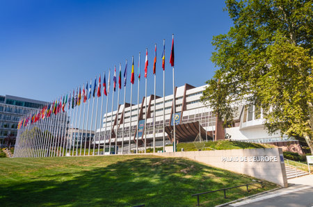 Strasbourg, France, August 2019. Three-quarter view of the Palace of Europe, the building that houses the headquarters of the Council of Europe. In evidence the banidiere of the member states.のeditorial素材