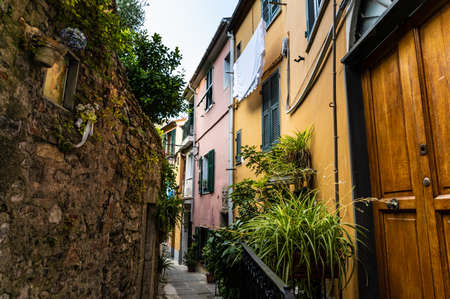 Porto Venere, Liguria, Italy. June 2020. Typical secondary alley in the heart of the town: they are called carruggio. On the right the doors of the houses overlook the narrow stone alley.のeditorial素材