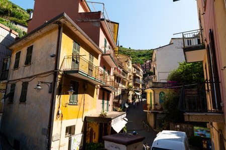 Manarola, Liguria, Italy. June 2020. The charm of the alleys of the seaside village, the houses with colored facades overlook the street. Beautiful summer day.のeditorial素材