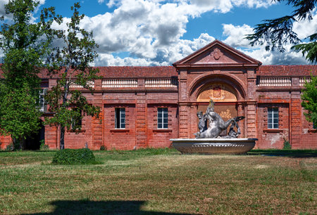 Venaria Reale,Piedmont,Italy. The summer royal residence of the Savoy family: the castle of the herd. In the inner courtyard there is a fountain with mythological creatures a horse and a man half fishのeditorial素材