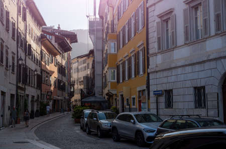 Trento, Italy, June 2021. Beautiful view of one of the streets of the historic center characterized by brightly colored facades. Beautiful summer day.のeditorial素材
