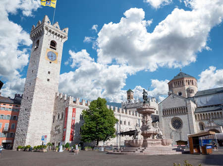 Trento, Italy, June 2021. Nice view of the main square: in evidence the bell tower, the fountain of Neptune and the cathedral. Nice sunny day.のeditorial素材