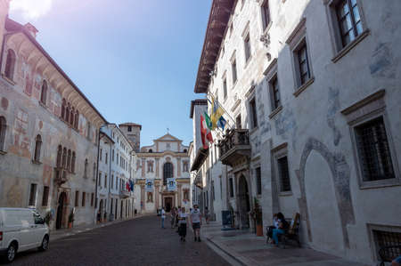 Trento, Italy, June 2021. One of the historic buildings in the center is characterized by a finely frescoed facade. In the background the Church of San Francesco Saverio.のeditorial素材