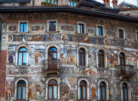 Trento, Italy, June 2021. The facade of Cazuffi-Rella houses in Duomo square, a finely frescoed historic building in the center.のeditorial素材