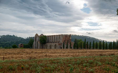 San Galgano, Chiusdino, Italy. August 2020. Stunning Tuscan landscape with the dilapidated and roofless abbey of San Galgano.のeditorial素材