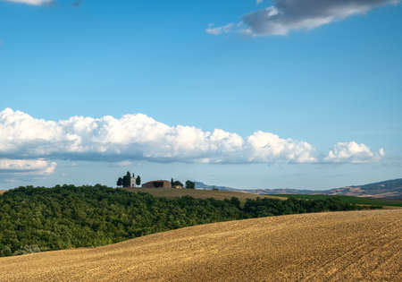 San Quirico d'Orcia, Tuscany, Italy. August 2020. The fascinating Chapel of the Madonna di Vitaleta on a beautiful sunny day. Blue sky with white clouds. Nobody.のeditorial素材