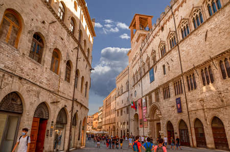 Perugia, Umbria, Italy. August 2021. The National Gallery of Umbria building is recognizable by the information signs on the facade. Lots of people on the street. Beautiful summer day.のeditorial素材