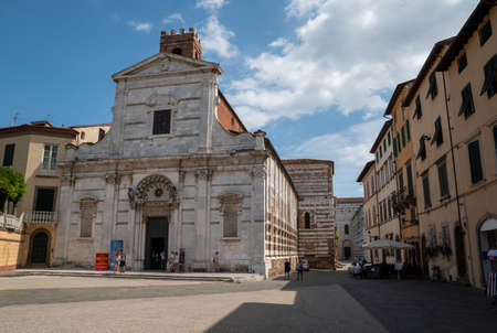 Lucca, Tuscany, Italy. August 2020. The facade of the church of Santi Giovanni e Reparata on a beautiful sunny day. People in the square.のeditorial素材