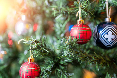 Christmas is Coming: Conceptual close-up image of the decorative balls on the branches of the Christmas tree.の写真素材