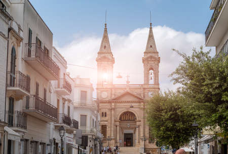 Alberobello, Puglia, Italy. August 2021. Amazing view of the cathedral Basilica of Saints Cosmas and Damian (Parrocchia Santuario Basilica S.S. Cosma E Damiano)の写真素材
