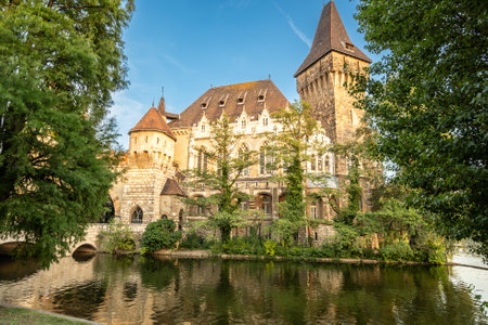 Budapest, Hungary. August 27, 2022. Wide-angle shot, looking down on Vajdahunyad Castle. Warm late afternoon light illuminates the facade. Fairytale atmosphere, travel destinations.の写真素材