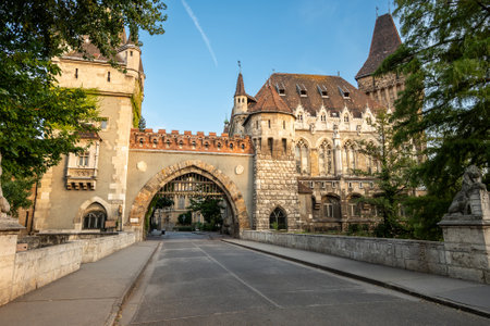 Budapest, Hungary. August 27, 2022. Shot walking towards the Gatehouse Tower entrance, warm late afternoon light illuminates the facade. We cross people, beautiful summer day. Travel destinations.の写真素材