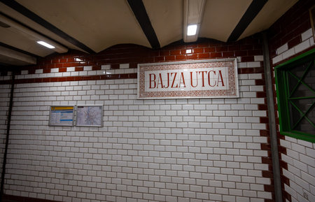Budapest, Hungary. August 27, 2022. Shot inside the historic metro line 1. Bajza utca stop. Highlighted are the wall covered with glazed tiles and the sign with the name of the station.の写真素材
