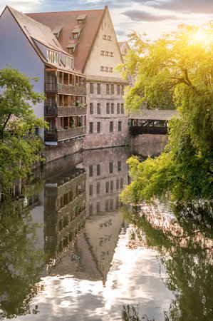 Nuremberg, Germany, August 2, 2023. Beautiful shot with an iconic image of the fairytale atmosphere of the place. On the beautiful summer day the house is reflected in the water.の写真素材
