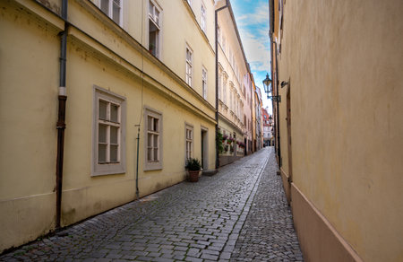 Prague, Czech Republic, August 9, 2023. A charming cobblestone alley in the Old Town. Perspective view. Travel destinations.の写真素材
