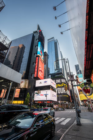 Times square, new york, usa august 14,2024. Times square commercial buildings and towering...