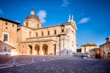 URBINO: Tourists visit the neoclassical Duomo di Urbino, Urbino Cathedral in the Marche region, Italyのeditorial素材