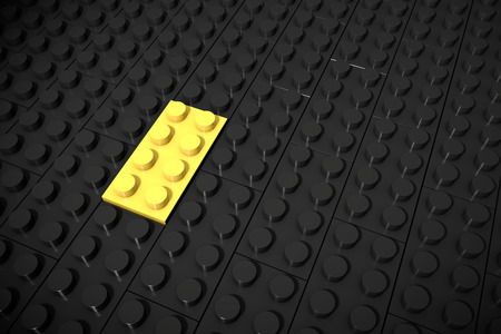 3d illustration: Yellow different toys piece lies separately on a black background is inserted in the groove. Business concept: unique, not like everyone else. Cube children's erector plastic set.の写真素材