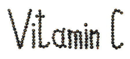 Vitamin C. Black currant berries on white backgroundの写真素材