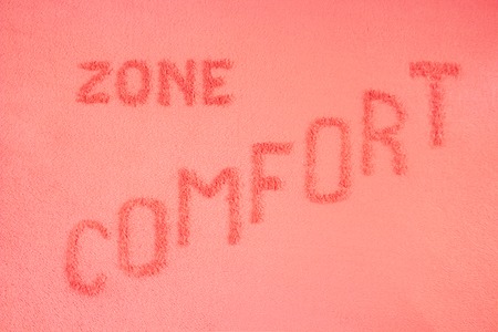 Comfort zone concept. The inscription is made on a pink blanketの写真素材