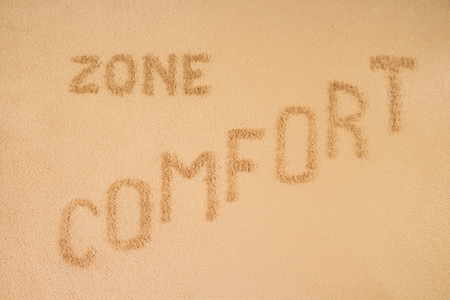 Comfort zone concept. The inscription is made on a brown blanketの写真素材