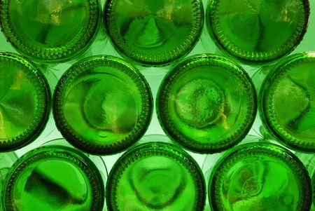 View of green beer bottles as seen from underneathの写真素材