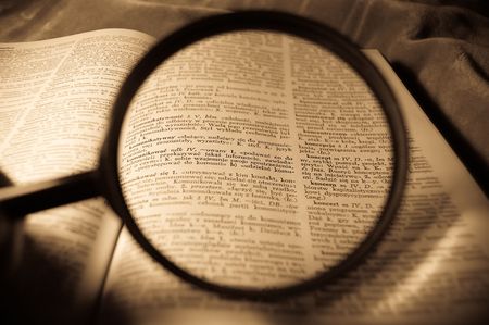 view through loupe at book,