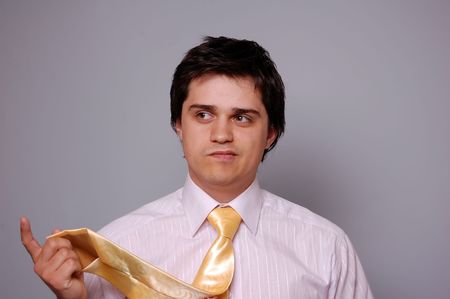 young men can't choice a tieの写真素材