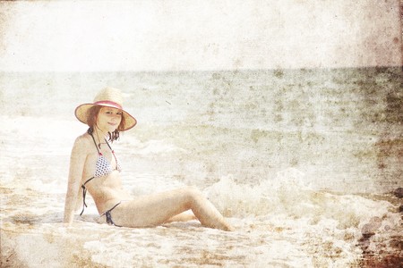 Sexy young red-haired girl on the beachの写真素材