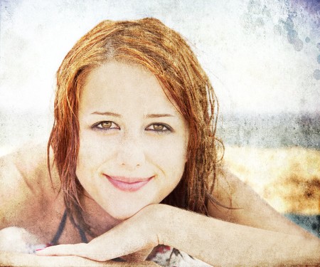Sexy young red-haired girl on the beachの写真素材