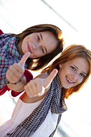 Two beautiful girls show OK の写真素材