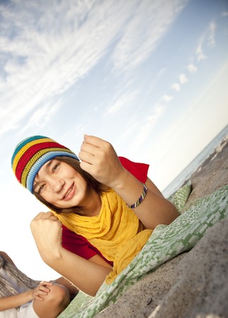 Portrait of beautiful brunet girl in capの写真素材