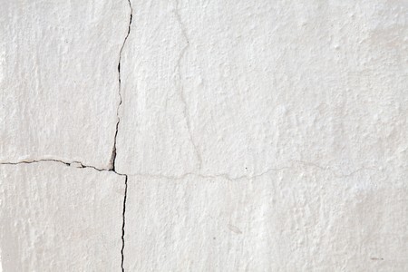Old cracked white wall for background.