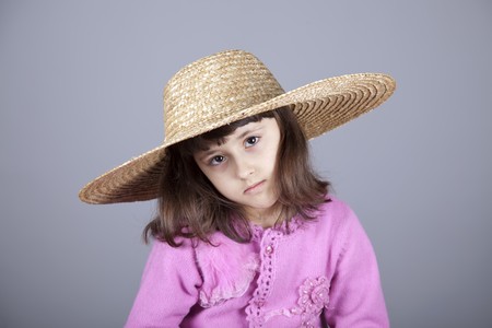 Sad girl in cap and glasses. Studio shot.の写真素材
