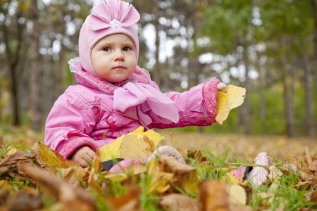 Little child in the park. Outdoor shot.の写真素材