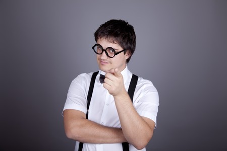 Portrait of funny fashion men in suspender with bow tie and glasses. Studio shot.の写真素材