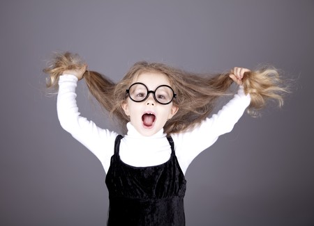 Little girl with long hair. Studio shot.の写真素材