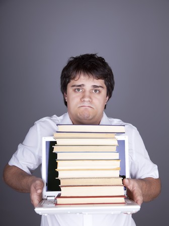 Sad men with books and white notebook. Studio sot.の写真素材
