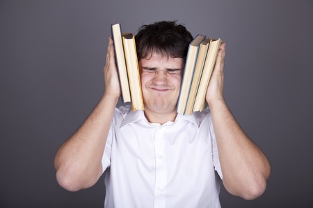 Tired men with books. Studio shot.