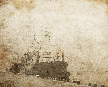 Old worker boat at the port. Photo in old vintage style.の写真素材