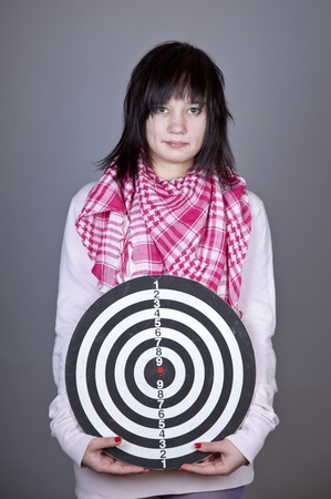 Girl with darts. Studio shot.の写真素材