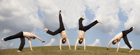 Men make acrobatic at meadow.の写真素材