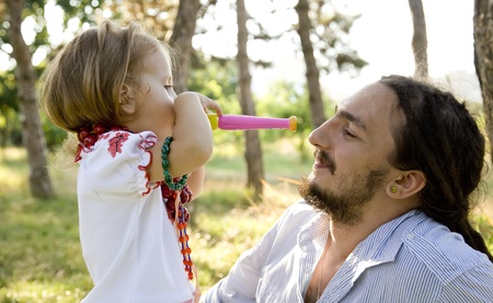 Father and daughter in the park.の写真素材