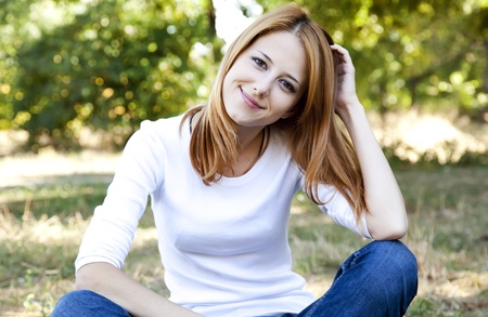 Portrait redhead girl at outdoor. Autumn.