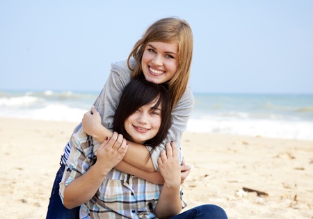 Two girls at outdoor near sea.の写真素材