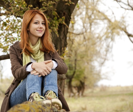 Beautiful girl at outdoor in autumn time.の写真素材