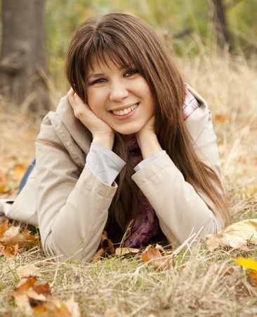 Girl in the autumn park. Outdoor shot.の写真素材